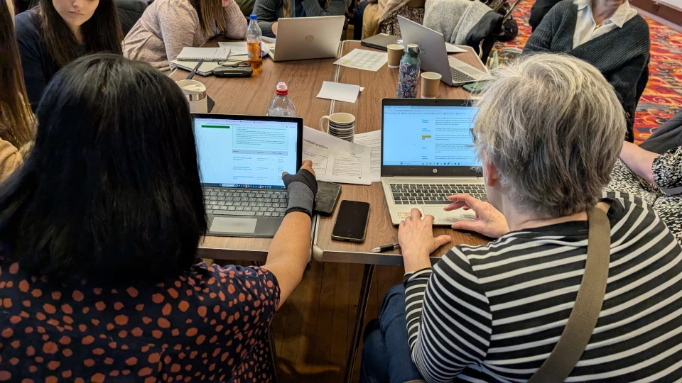 People using laptops in a conference