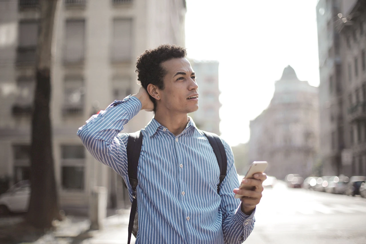 man checking directions on his smart phone