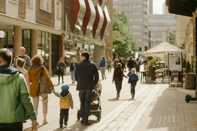 Families walking in a high street